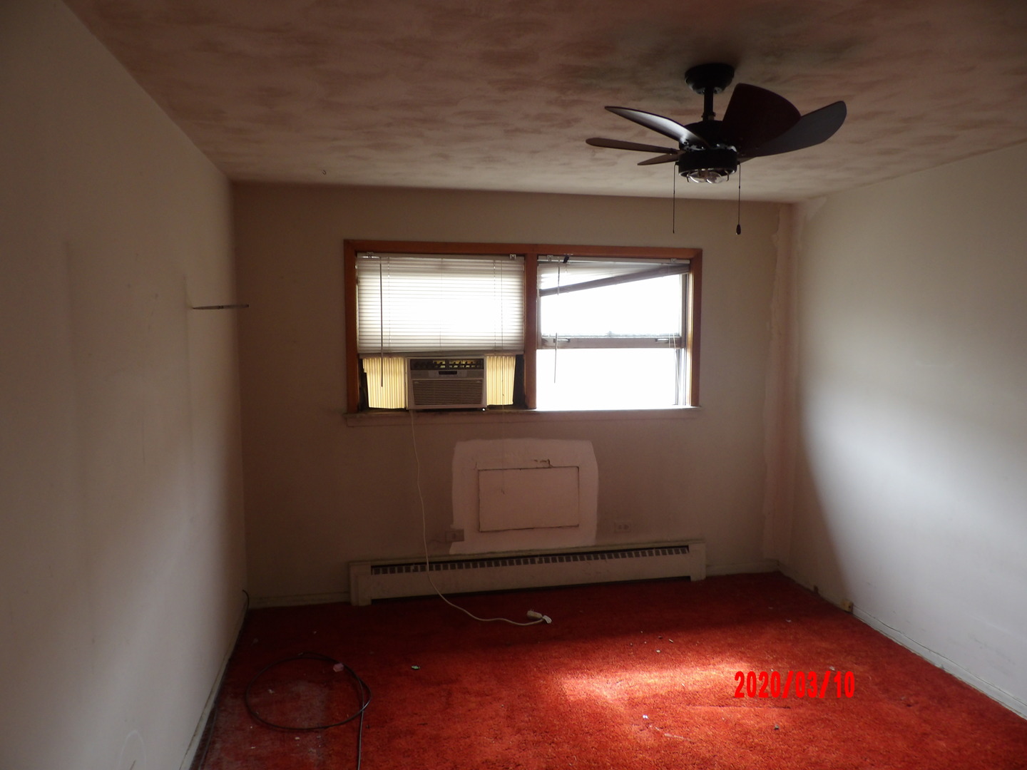 9211 South Cottage Grove Avenue, Unit 9C2 Chicago, IL 60619 - Photo 2 of 6 an empty room with windows