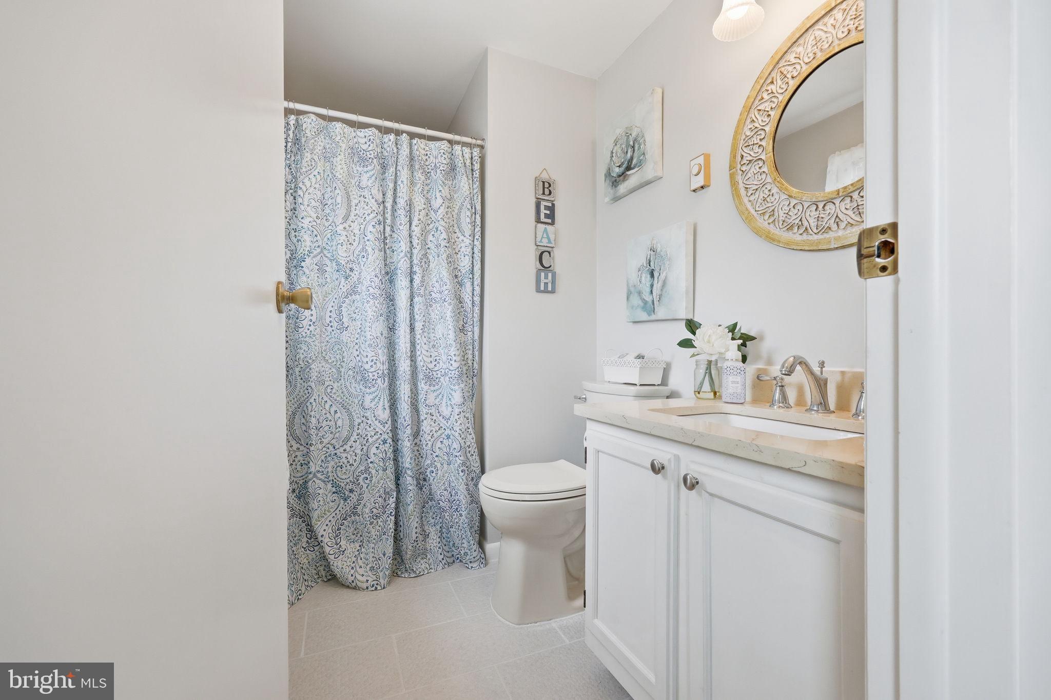 173 Cove Road Newport, NJ 08345 - Photo 21 of 72 a bathroom with a sink a toilet and a mirror