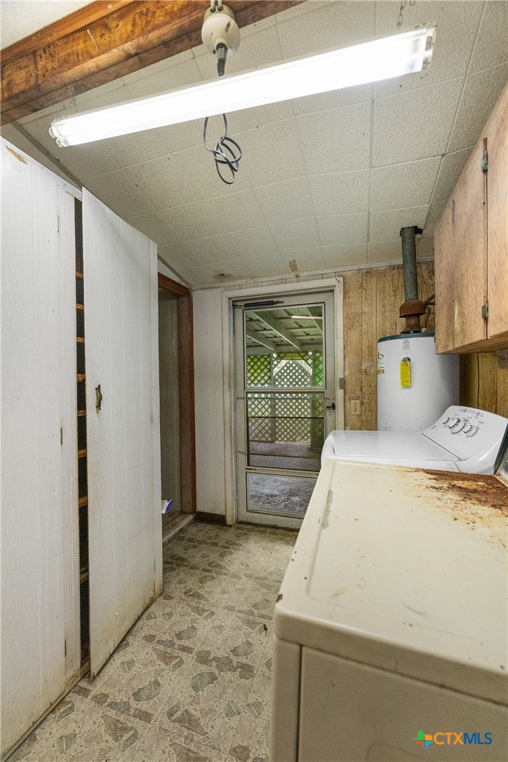 401 Kerr Street Edna, TX 77957 - Photo 22 of 23 a view of storage and utility room with washer and dryer