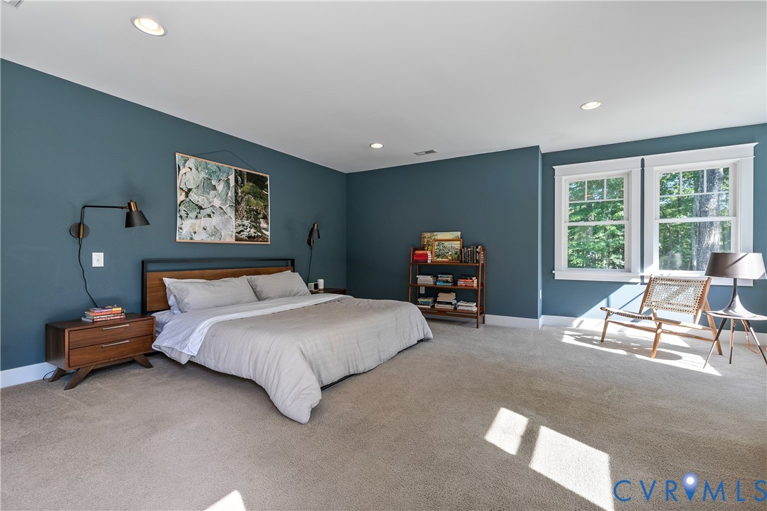 9749 Hoke Brady Road Henrico, VA 23231 - Photo 27 of 53 a spacious bedroom with a bed and a large window