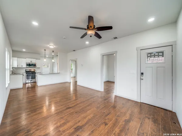 a view of kitchen with cabinets and wooden floor