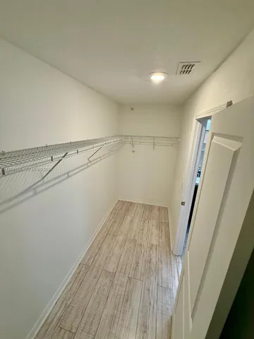 a view of a room with racks on the wall