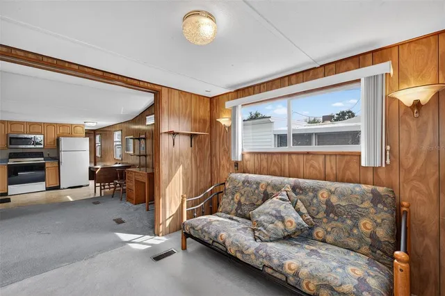 a living room with a couch and a window