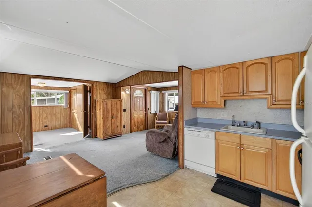 a view of a livingroom with furniture and windows