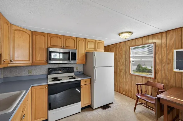 a view of a lake with houses in the back