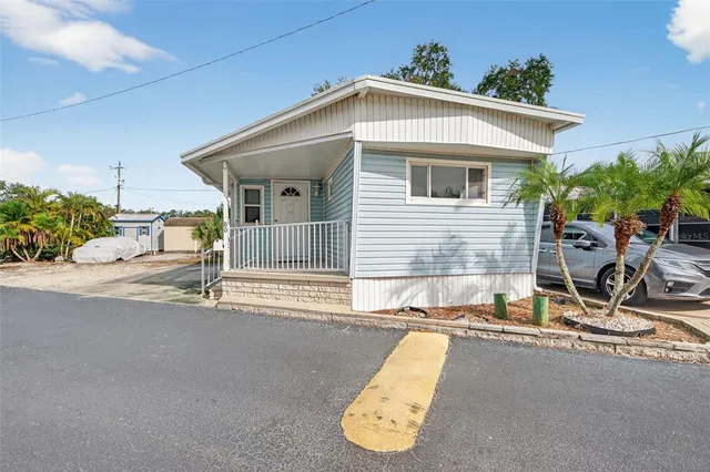 a view of a house with backyard