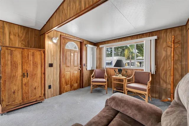 a view of a livingroom with furniture and windows