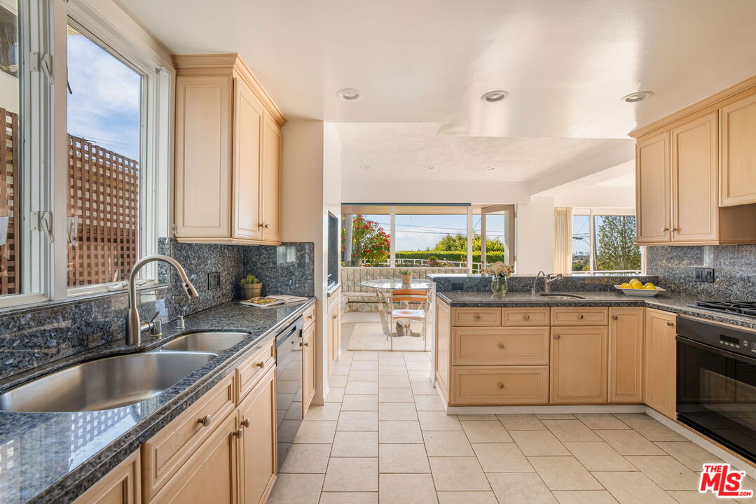 810 Franklin Street Santa Monica, CA 90403 - Photo 12 of 49 a kitchen with sink a stove and cabinets