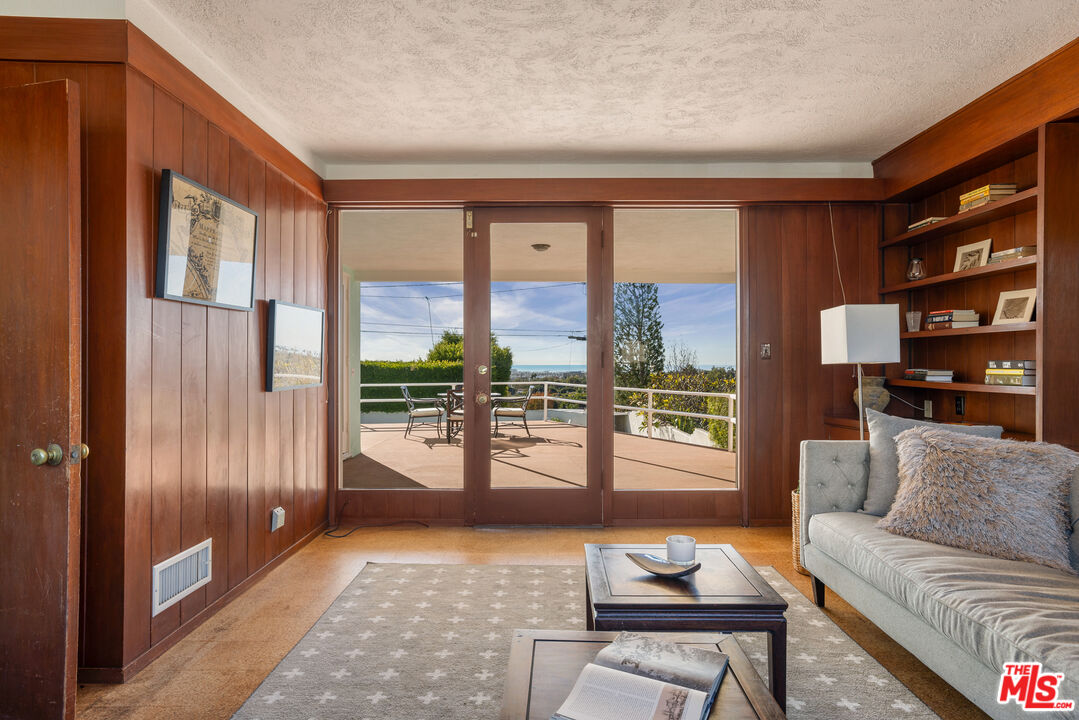 810 Franklin Street Santa Monica, CA 90403 - Photo 14 of 49 a living room with furniture and a floor to ceiling window