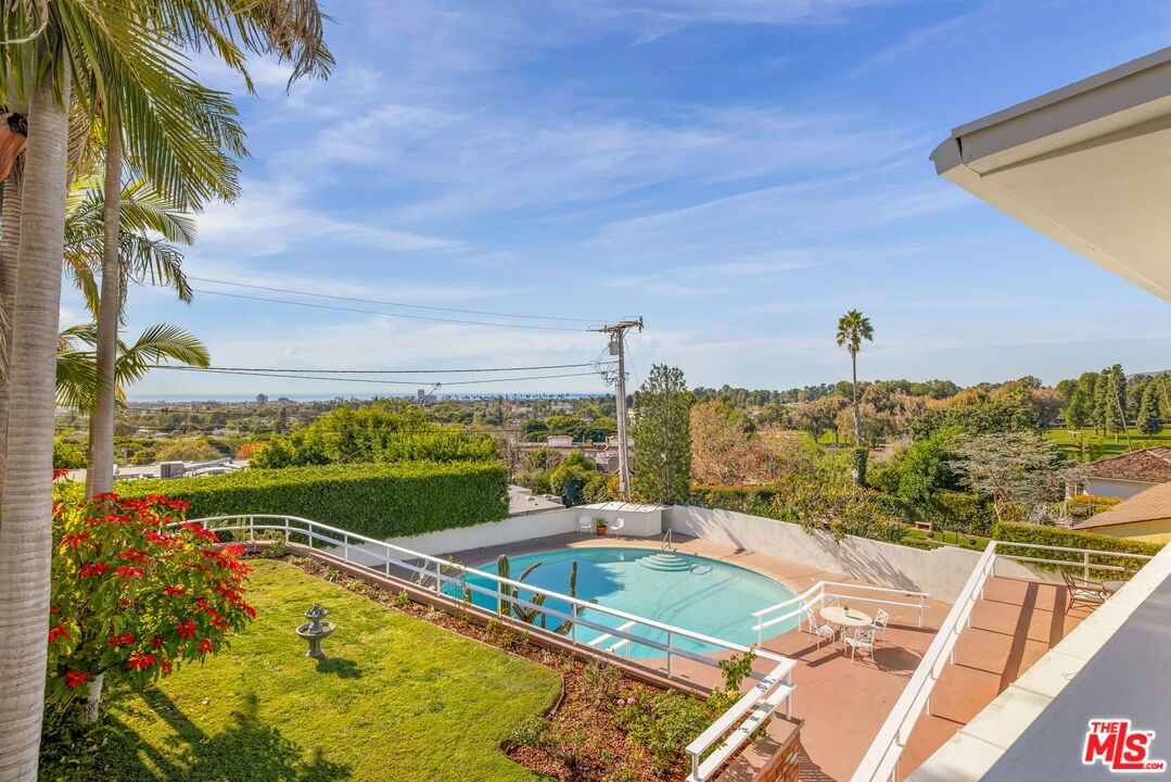 810 Franklin Street Santa Monica, CA 90403 - Photo 41 of 49 a view of a swimming pool with a lake view and mountain view
