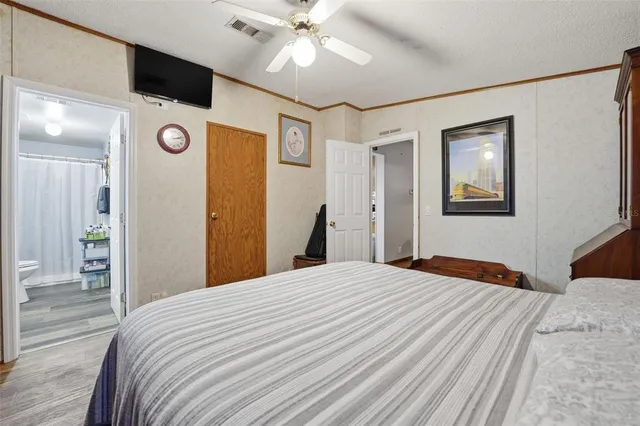 a bathroom with a granite countertop sink a toilet and shower