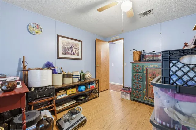 a room with furniture and a wooden floor