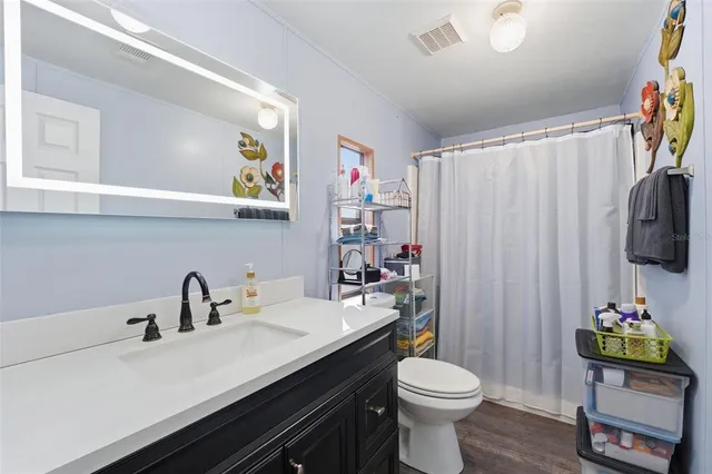 a kitchen with refrigerator and washer