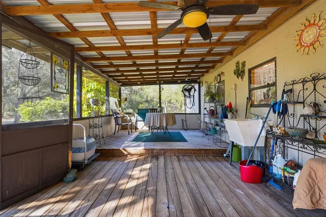 a view of a living room and wooden floor