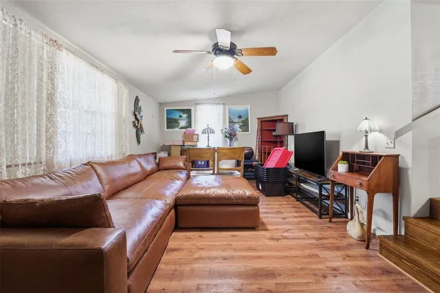 a living room with furniture and a window