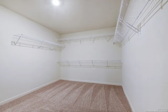 a view of a room with racks on the wall