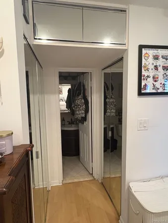 a bathroom with a sink toilet and a mirror