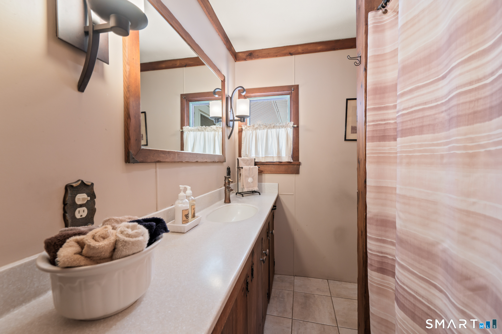 12 Booth Road Enfield, CT 06082 - Photo 23 of 30 a bathroom with a sink and mirror