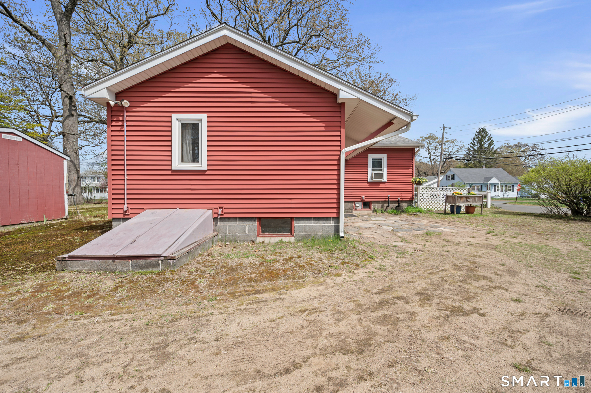 12 Booth Road Enfield, CT 06082 - Photo 5 of 30 a view of a house with a yard and wooden fence