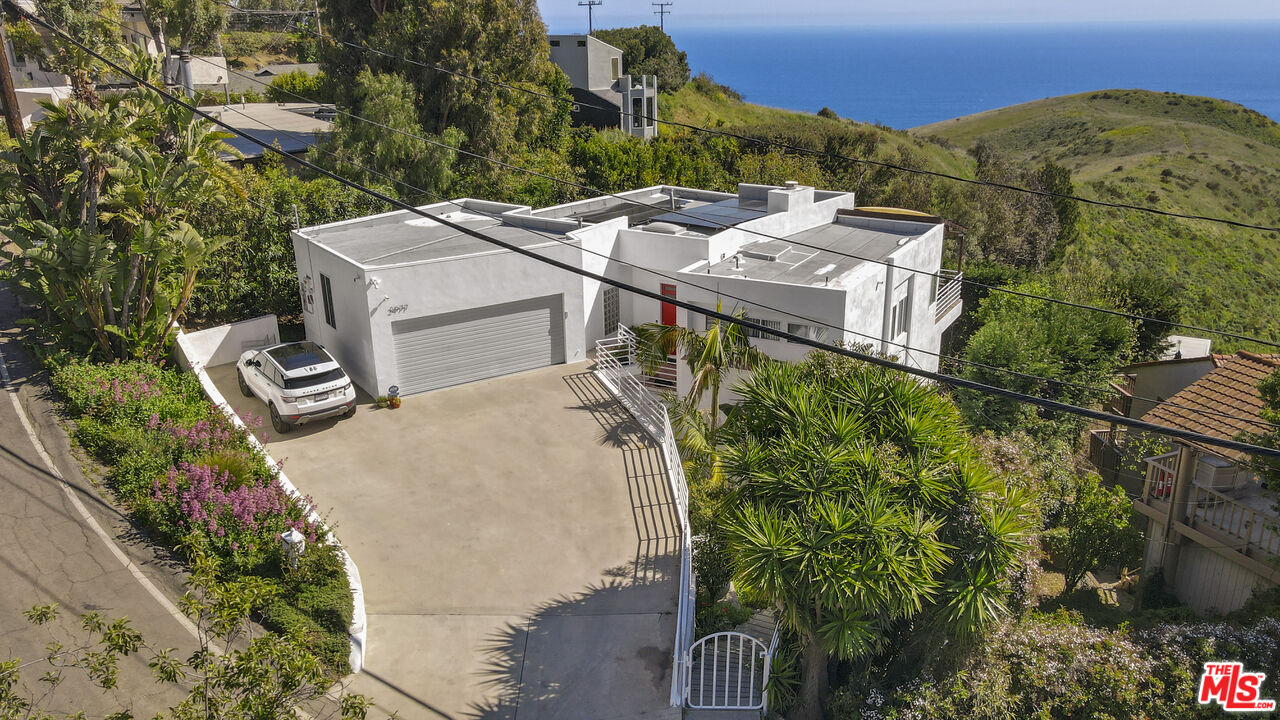 2977 Seabreeze Drive Malibu, CA 90265 - Photo 15 of 48 an aerial view of a house with a yard and lake view