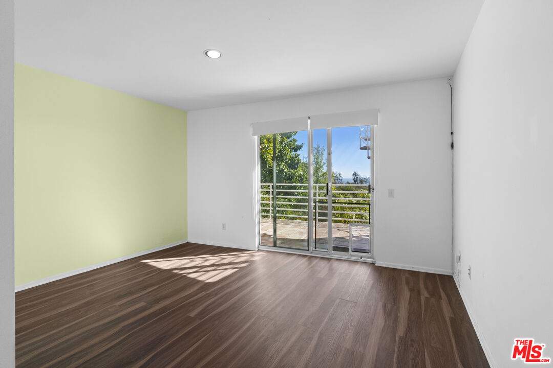 2977 Seabreeze Drive Malibu, CA 90265 - Photo 17 of 48 a view of an empty room with wooden floor and a window