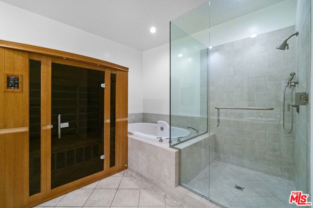 2977 Seabreeze Drive Malibu, CA 90265 - Photo 23 of 48 a bathroom with a shower and a sink mirror