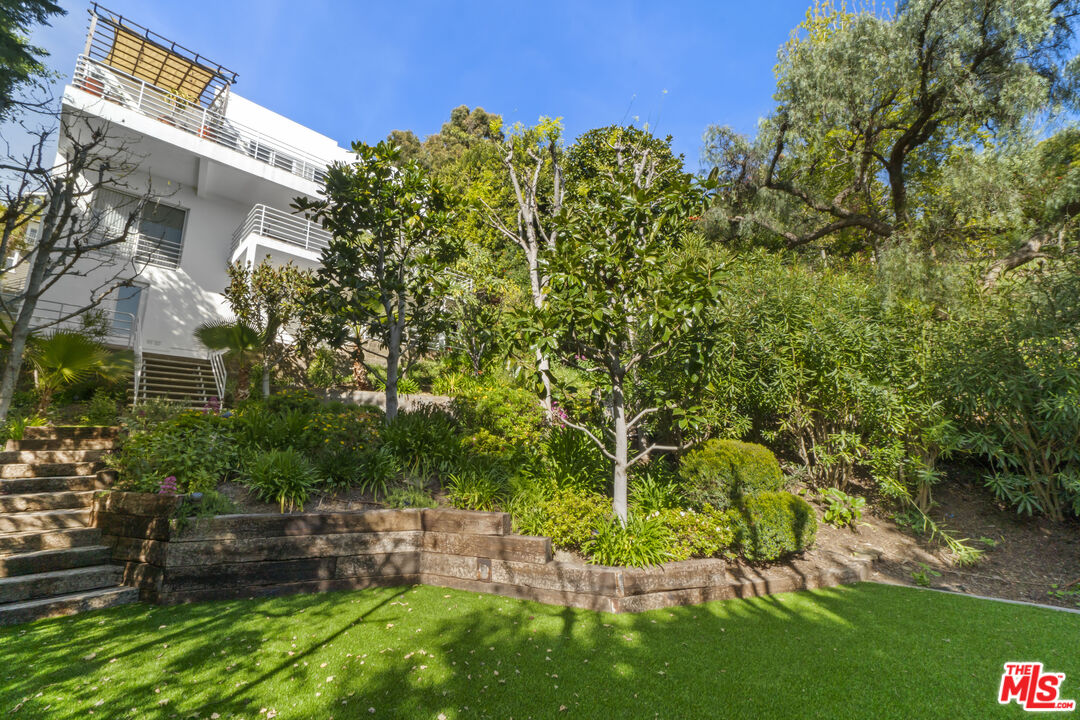 2977 Seabreeze Drive Malibu, CA 90265 - Photo 40 of 48 a view of a yard with plants and large trees