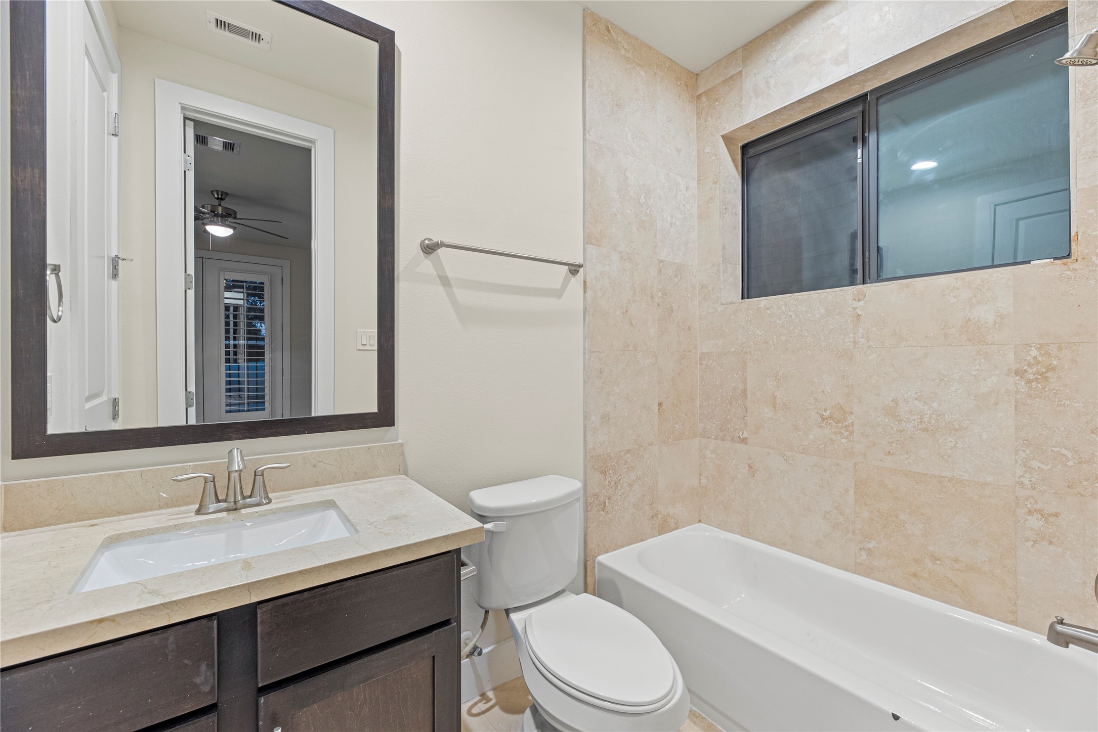 2513 B Garrow Street Houston, TX 77003 - Photo 8 of 28 Ground floor en-suite bathroom with a tub/shower combination.