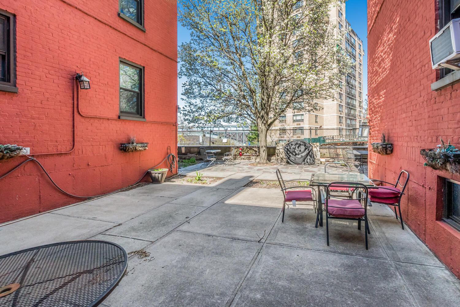 512 Kappock Street, Unit 3J Bronx, NY 10463 - Photo 16 of 20 a backyard of a house with outdoor seating