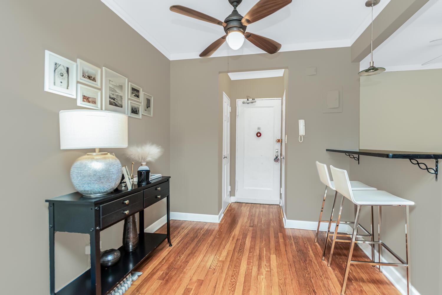 512 Kappock Street, Unit 3J Bronx, NY 10463 - Photo 5 of 20 a living room with furniture and a wooden floor