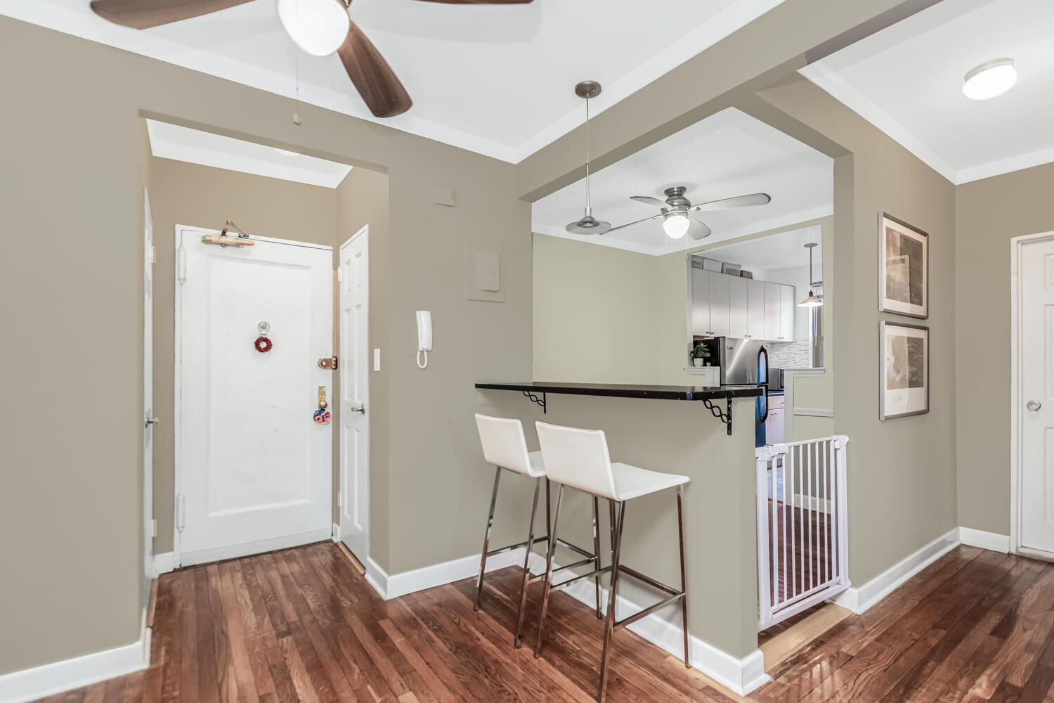 512 Kappock Street, Unit 3J Bronx, NY 10463 - Photo 6 of 20 a view of a hallway with wooden floor and staircase
