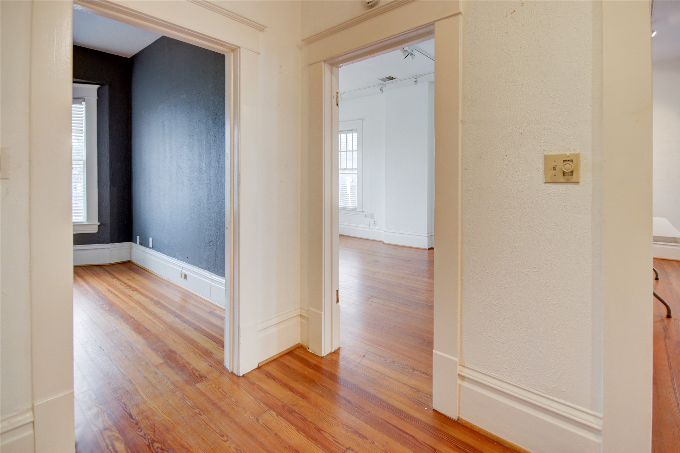 239 Westheimer Road Houston, TX 77006 - Photo 20 of 50 SECOND FLOOR: Hallway looking into the two bedrooms on this floor
