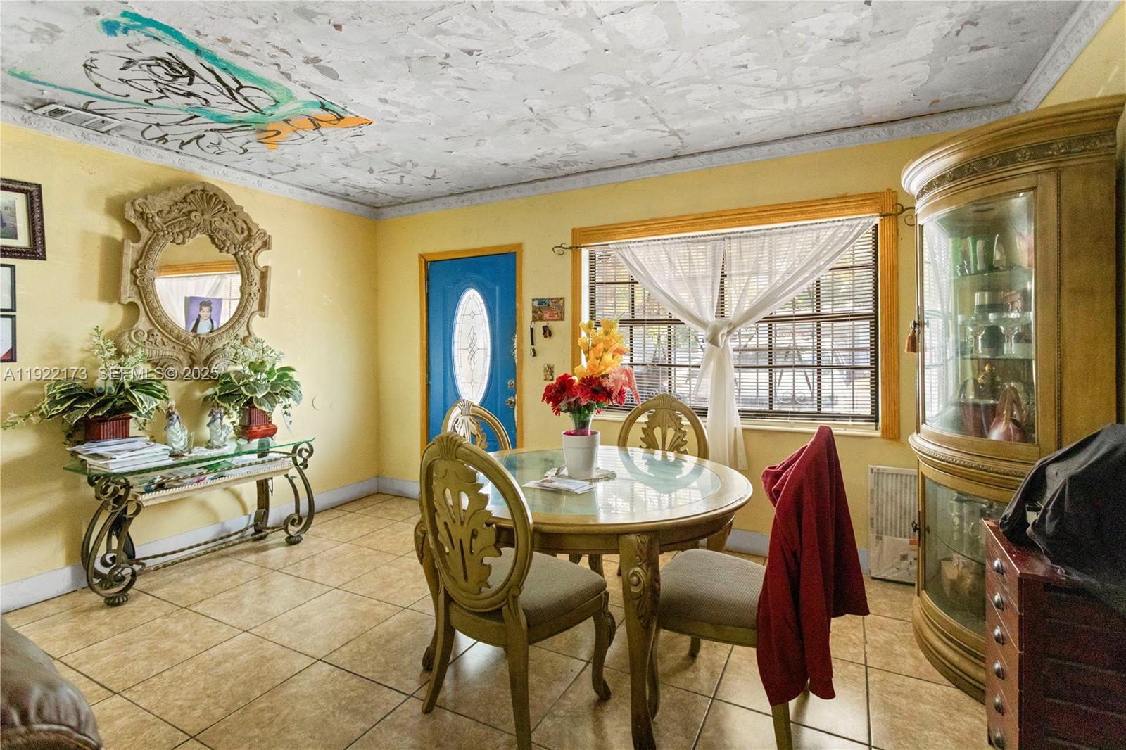 1341 Northwest 132nd Street Miami, FL 33167 - Photo 12 of 52 a view of a dining room with furniture and a window