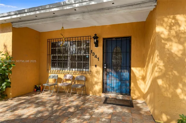 a view of a door and a chair