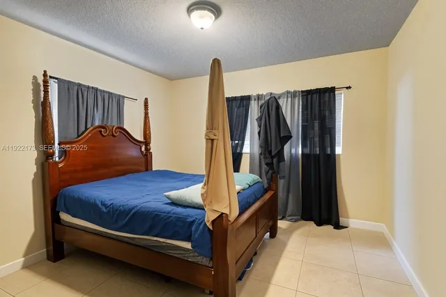 a bedroom with a bed and a walk in closet