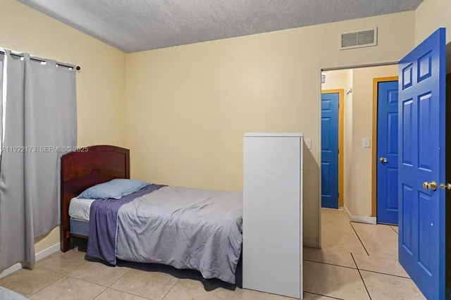 a bedroom with a bed and a closet