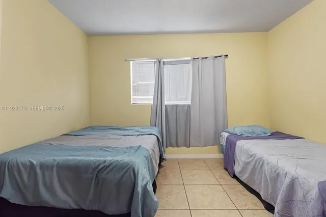 a bedroom with a bed and a cabinets