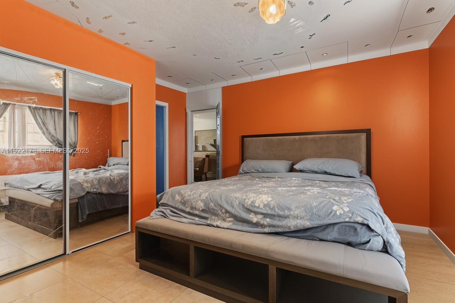 1341 Northwest 132nd Street Miami, FL 33167 - Photo 29 of 52 a bedroom with a bed and large window