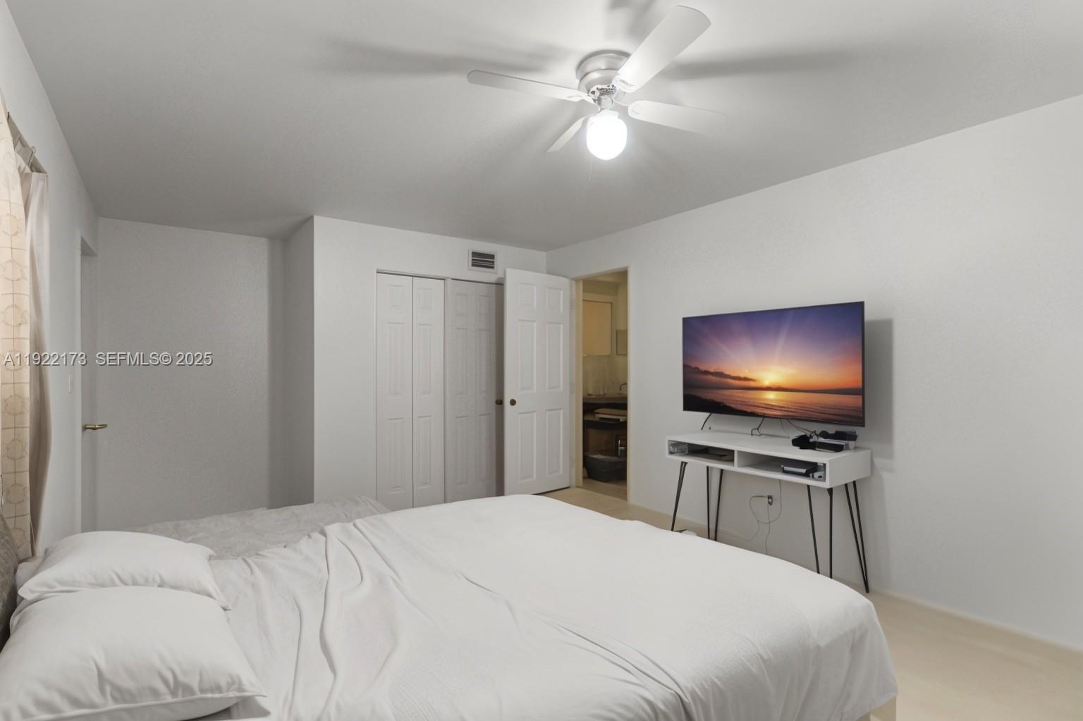 1341 Northwest 132nd Street Miami, FL 33167 - Photo 32 of 52 a bedroom with a bed and a flat screen tv