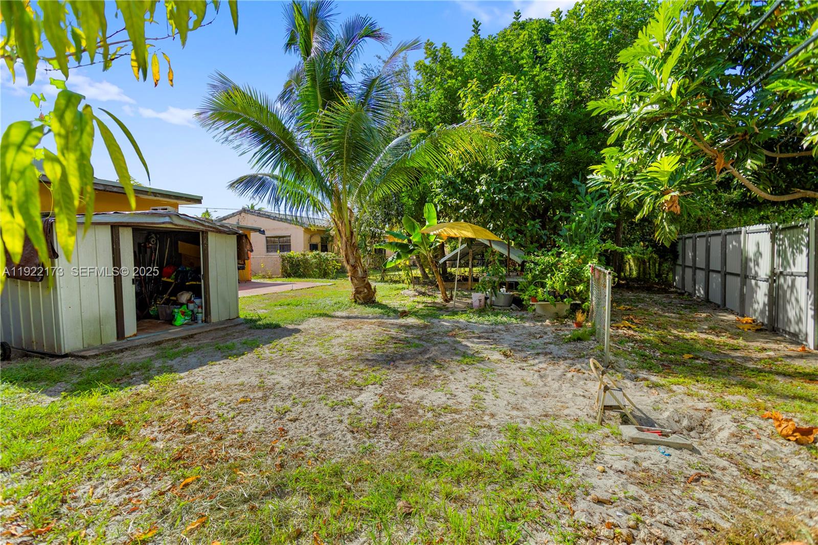 1341 Northwest 132nd Street Miami, FL 33167 - Photo 48 of 52 a view of a house with a yard and tree s