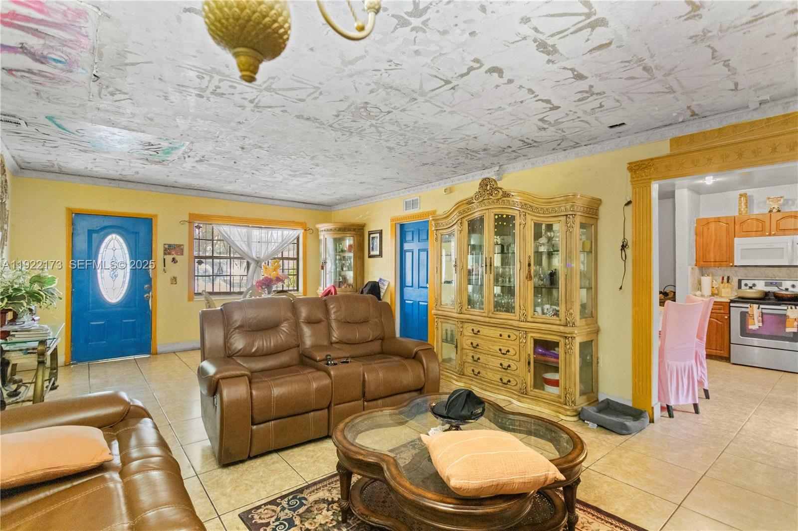 1341 Northwest 132nd Street Miami, FL 33167 - Photo 8 of 52 a living room with furniture and a flat screen tv