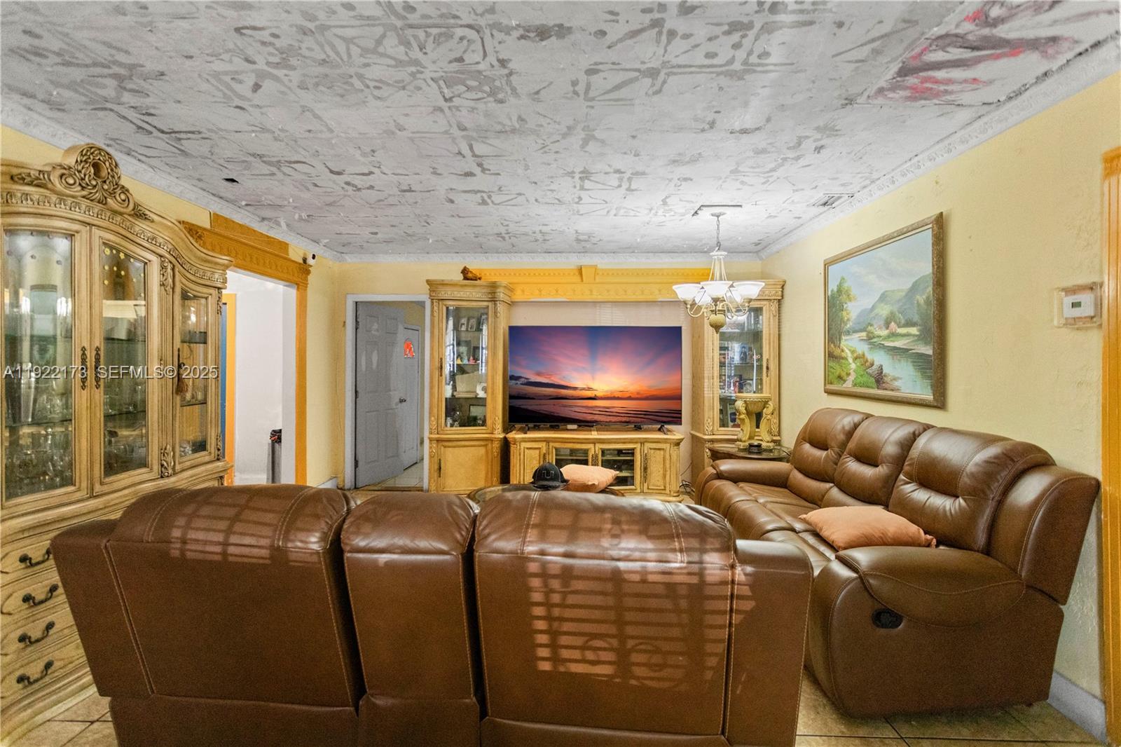 1341 Northwest 132nd Street Miami, FL 33167 - Photo 10 of 52 a living room with furniture and a flat screen tv