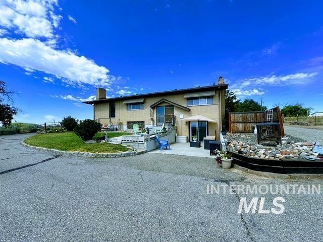 4436 Baker Road Ontario, OR 97914 - Photo 1 of 1 Split foyer home with a patio area and a chimney