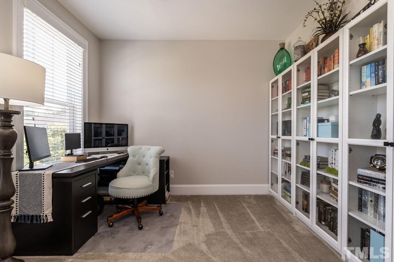 3034 Adonis Circle Raleigh, NC 27612 - Photo 34 of 46 a view of a workspace with furniture and a window