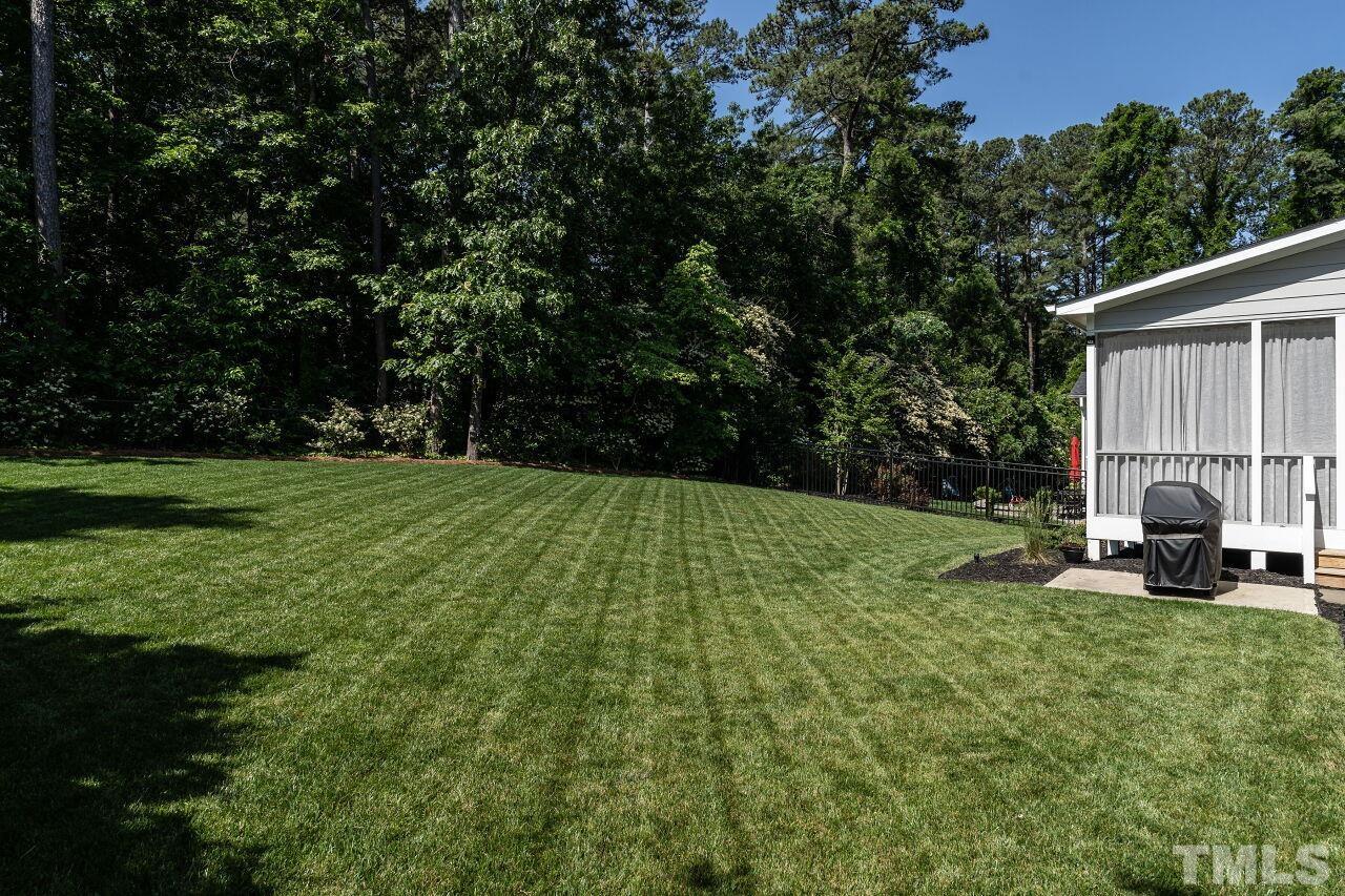3034 Adonis Circle Raleigh, NC 27612 - Photo 39 of 46 a view of a garden with sitting area