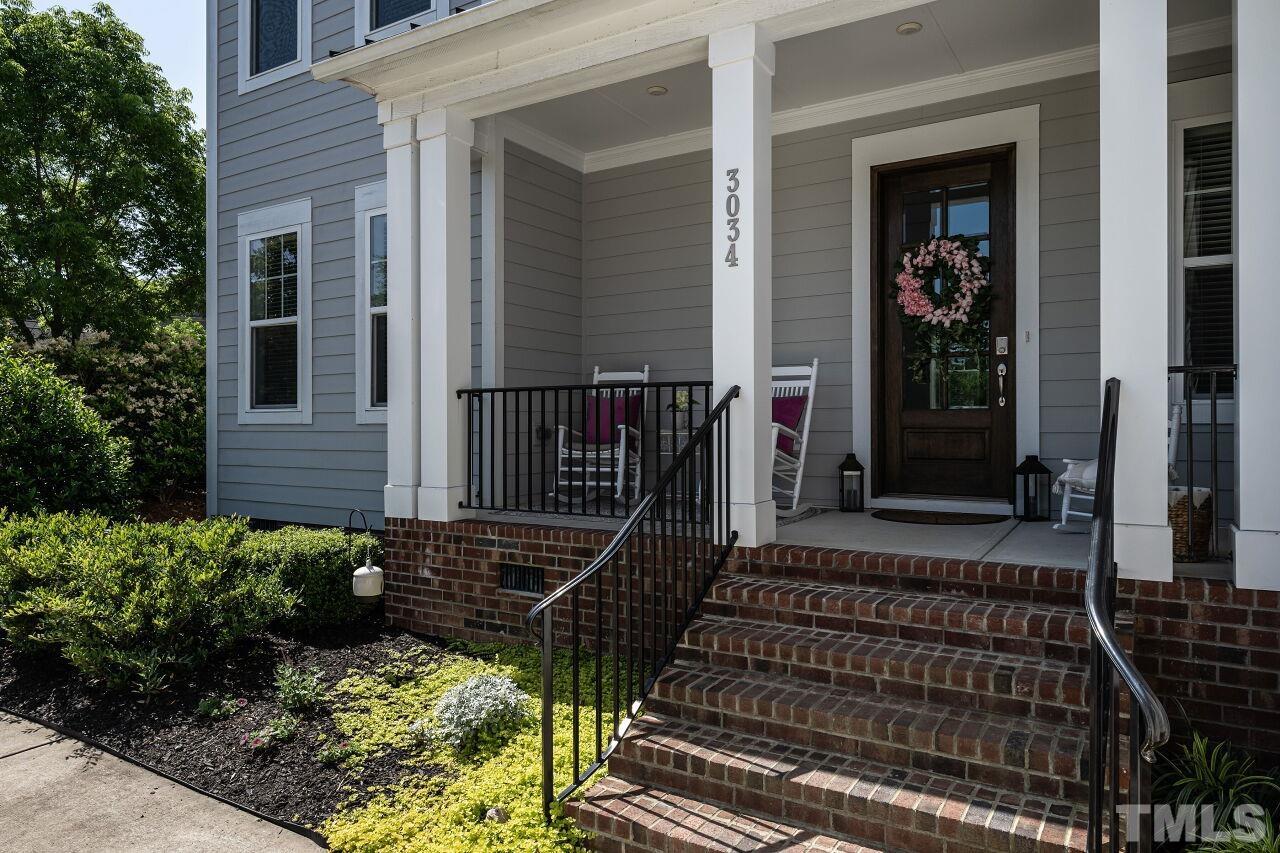 3034 Adonis Circle Raleigh, NC 27612 - Photo 4 of 46 front view of a house with a small yard