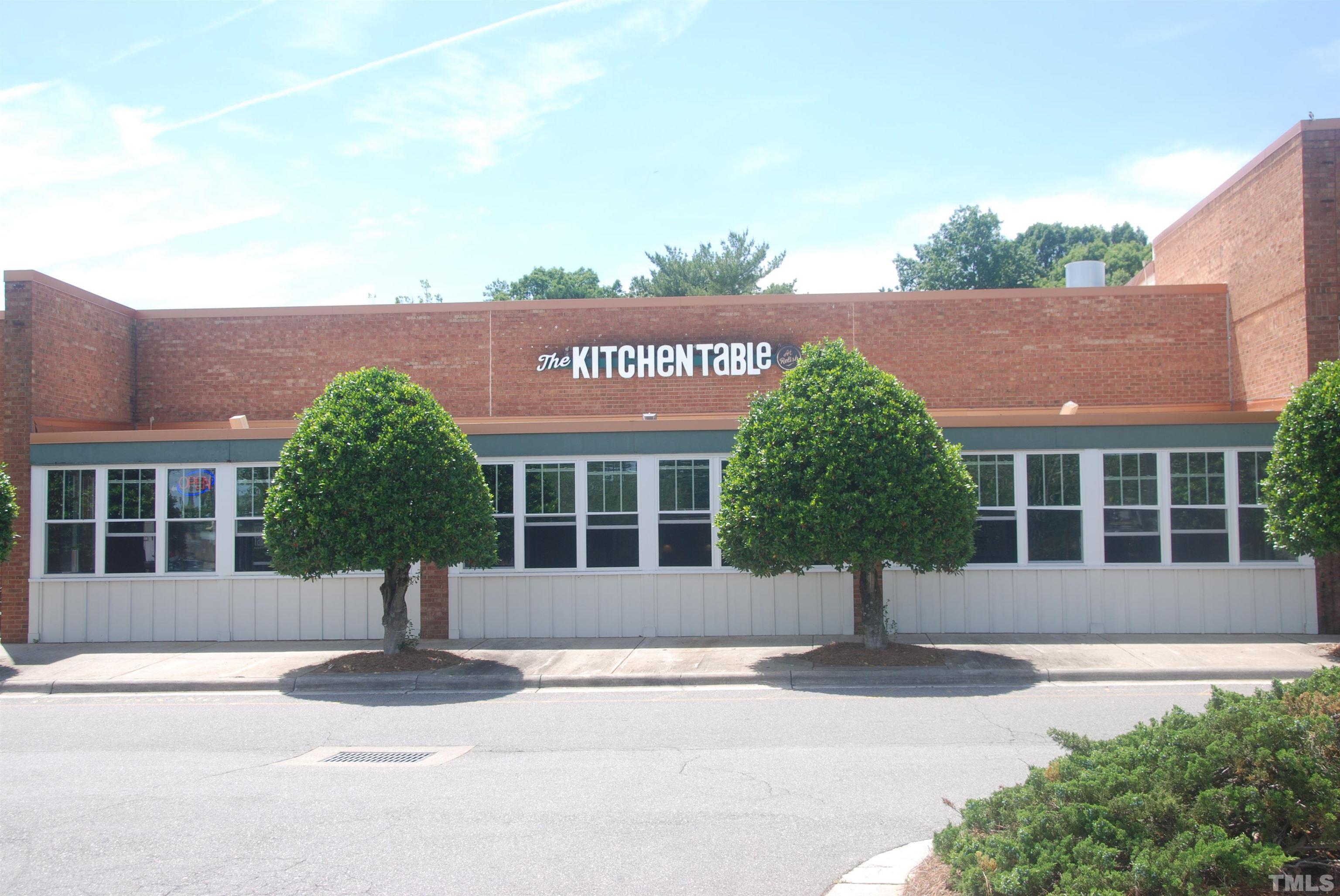 3034 Adonis Circle Raleigh, NC 27612 - Photo 42 of 46 front view of a building with a yard