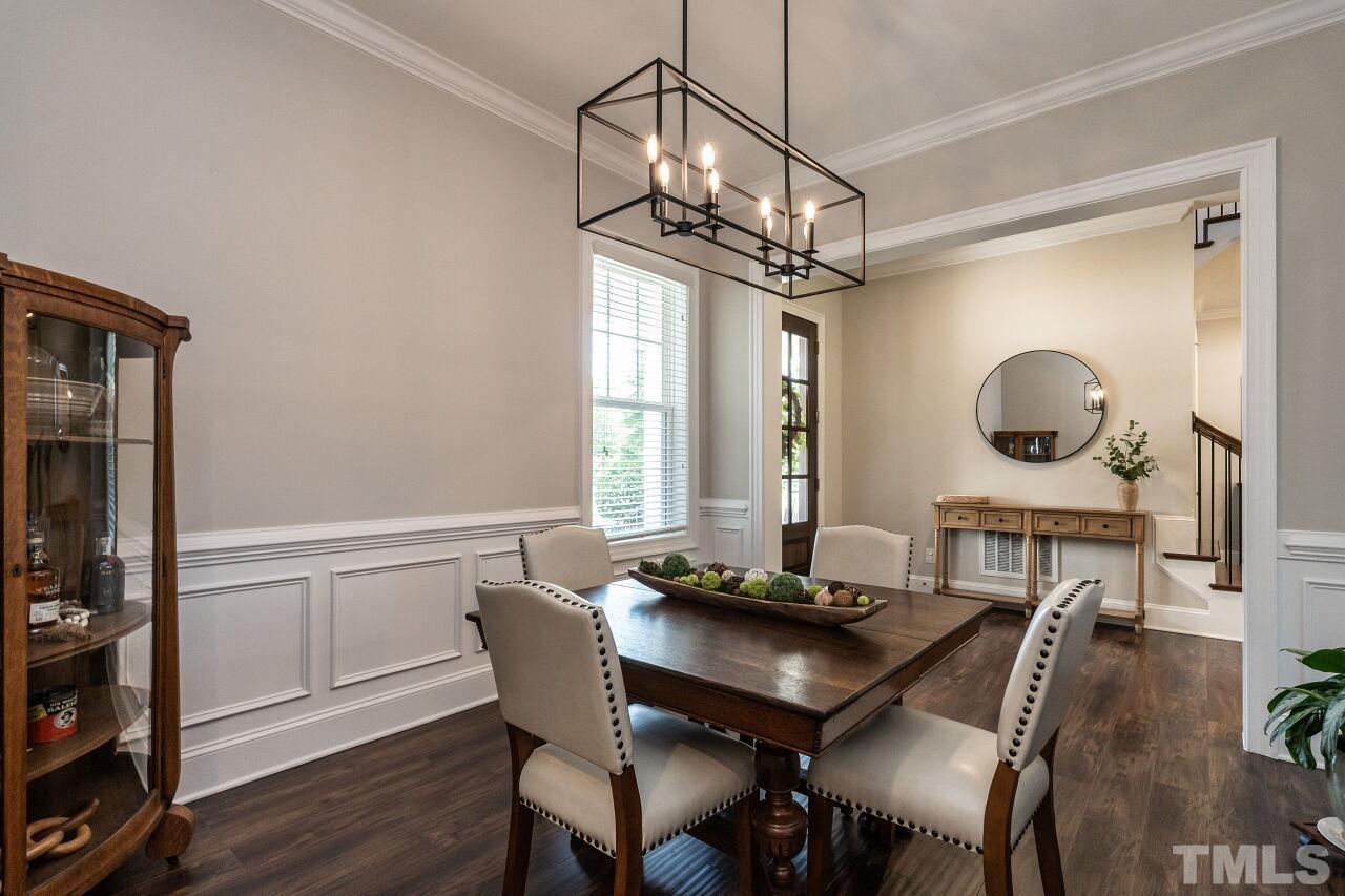 3034 Adonis Circle Raleigh, NC 27612 - Photo 7 of 46 a view of a dining room with furniture window and wooden floor