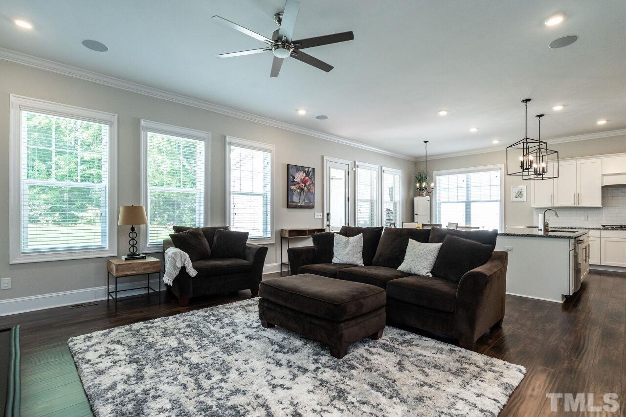 3034 Adonis Circle Raleigh, NC 27612 - Photo 10 of 46 a living room with furniture and a large window