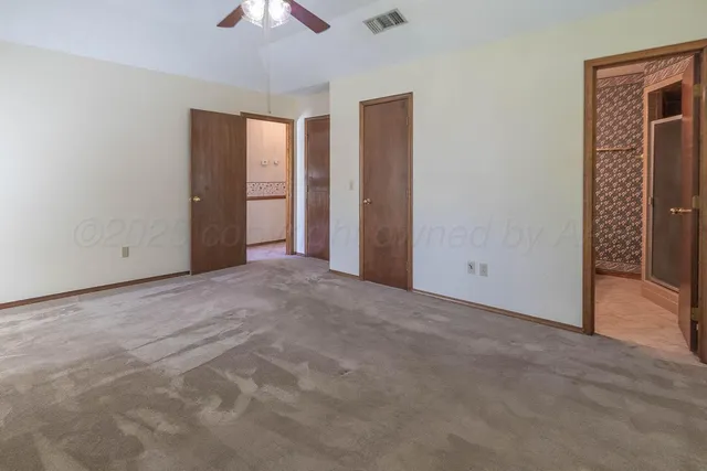 a front view of a house with a garden and patio